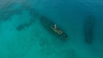 Aerial perspective of a kayak floating above a shipwreck, Carlisle Bay, Barbados